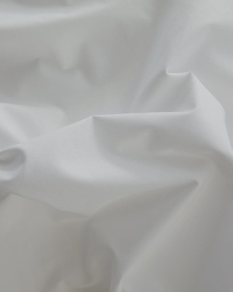 Gros plan sur le tissu en coton tissé du cache-sommier FamBed